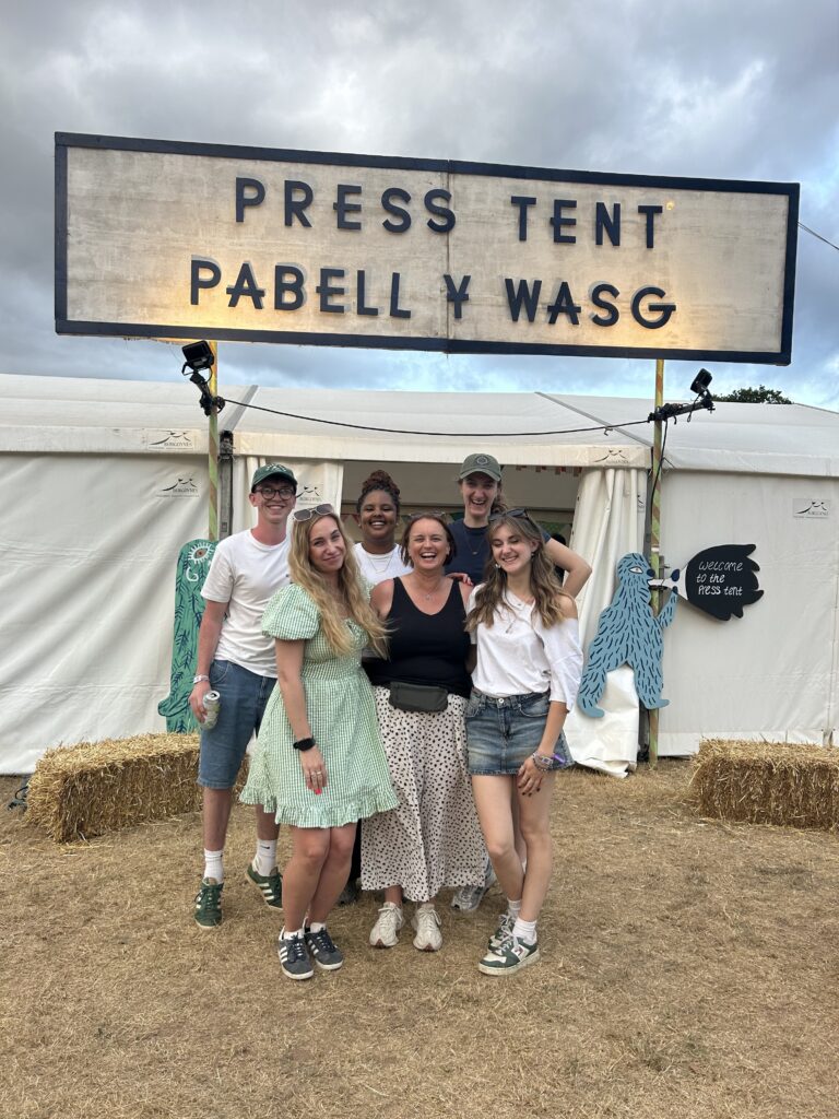 a group of people standing together and smiling